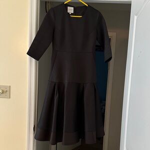 Elegant Black Dress with Flared Skirt